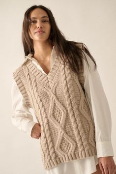 This trendy and unique sweater vest will be on repeat all season long! Wear it alone or layer it over a top or dress and pair with some boots for a cute Fall outfit. Our Enjoy The Moment Cable Knit Sweater Vest in Light Mocha features a v neckline, beautiful cable knit design on the front, ribbed neckline, hem and arms, sleeveless, and a relaxed fit. Also available in off white. Fit: True to size. Relaxed. 100% Polyester. Model is wearing a size Small. Cold Weather Essentials, Cable Knit Sweater Vest, Unique Sweater, Enjoy The Moment, Knit Sweater Vest, Unique Sweaters, Maxi Dress Pattern, Western Chic, Sporty And Rich