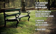 a bench sitting on top of a lush green field next to a park path and trees