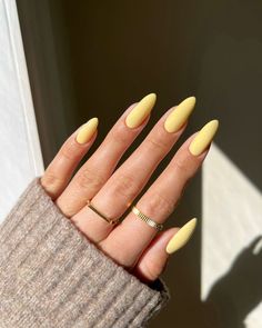 Capture the essence of sunny days with our radiant summer yellow nails! Flash a smile on your hands with a color that's as warm and inviting as a sunny afternoon. Pastel Yellow Almond Acrylic Nails, Pastel Yellow Almond Nails, Pastel Yellow Nail Ideas, Pastel Yellow Nails, Nails Palm Tree