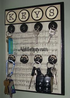 keys are hanging on the wall with music notes