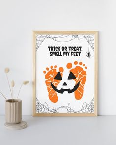 an orange and white halloween poster with the words trick or treat, smell my feet