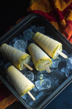 there are three banana pops on top of ice