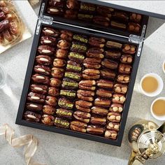 an assortment of dates and teas on a table