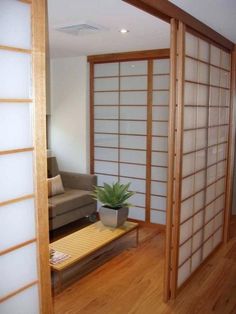 a living room with a couch and sliding glass doors