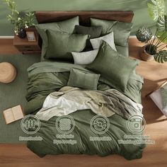 a bed with green sheets and pillows on top of it next to a potted plant