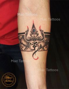 a man's arm with a tattoo on it that has an anchor in the middle