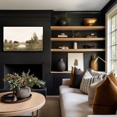 a living room filled with furniture and a fire place in front of a painting on the wall