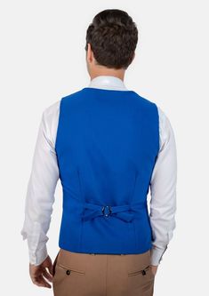 This Royal Blue Vest is designed with stretch cotton for comfort, and features a vibrant royal blue hue that is modern and bold. Looking to stand out and make your presence known? This vest is a great choice. Fitted Blue Vest Outerwear, Fitted Blue Vest For Workwear, Blue Fitted Vest For Work, Blue Stretch Vest For Spring, Blue Sleeveless Vest For Workwear, Blue Sleeveless Vest For Work, Tailored Sleeveless Blue Vest, Blue Vest Top For Work, Blue Vest