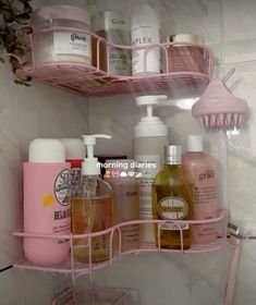 pink bathroom shelf with soaps, lotions and hand sanitizers