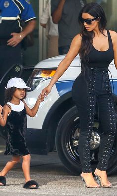 North West Hits Paparazzi With Her Signature Side-Eye While Out With Kim Kardashian Lace Up Pants, Givenchy Sunglasses, Party Mode