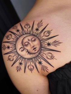 a woman's stomach with a sun and moon tattoo on the back of her shoulder