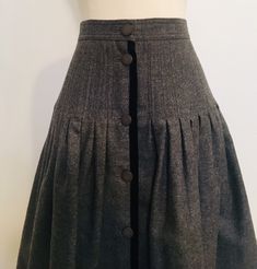 "True gem! This 80s Miss V Valentino wool buttoned down skirt with black velvet trim. Pleated fit and flare. Made in Italy. Excellent vintage condition. Labeled 42/8.  Laid flat: 13.5\" waist,  19.5\" hips,  22\" top to bottom. Please note that vintage sizing can be tricky due to mass production today, size labels vary. Please see measurements to help. Thank you and enjoy" Fitted A-line Skirt With Buttons, A-line Fitted Skirt With Buttons, Fall Fitted Skirt With Button Cuffs, Full Skirt With Button Closure And Fitted Waist, Formal Fall Skirt With Buttons, Vintage Winter Skirt With Buttons, Knee-length Skirt With Buttons For Winter, Knee-length Winter Skirt With Buttons, Knee-length Button Skirt For Winter