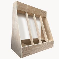 a wooden box with three compartments on the front and one in the back that is empty