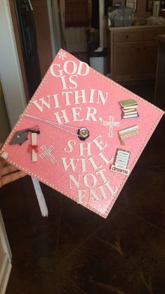 a pink graduation cap that says god is within her she will find it