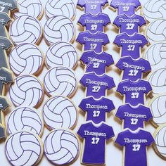 cookies decorated to look like volleyball uniforms and numbers are arranged in rows on a table