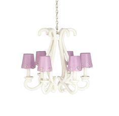 a white chandelier with pink shades on it