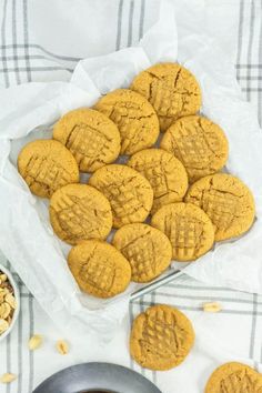 peanut butter cookies in a bowl and on a table