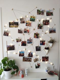 a white table topped with pictures and lights