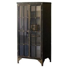 a tall black cabinet with glass doors and metal trimmings on the bottom shelf