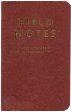 a red book with the words field notes written in gold on it's cover