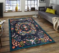 a living room with a couch and rug on the floor