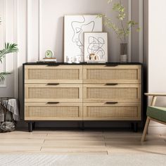 a room with a dresser, chair and potted plant on the sideboard in it