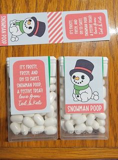 two bags of snowman poop candy on a table