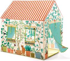 a toy house with an orange and white striped roof, windows, trees and animals