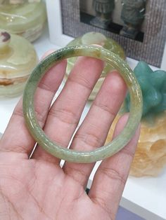 Vintage, cylindrical, slim cut Jade bangle, Type A (non-bleached, non-dyed, non-treated). High gloss, semi-translucent, tricolored with beautiful smoky green, honey and black smears. Size 56 (5.6 cm inner diameter), 0.75 cm width and 0.75 cm thickness. Cheap Green Crystal Bangle Bracelet, Elegant Jade Round Bangle, Luxury Green Jade Bangle, Carved Jade Bangle Bracelet, Carved Jade Bangle, Jade Bracelet Bangles Chinese, Jade Dragon, White Jade, Jade Bangle