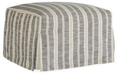 a grey and white striped ottoman