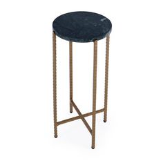 a black marble top side table with gold metal legs and an iron frame, on a white background