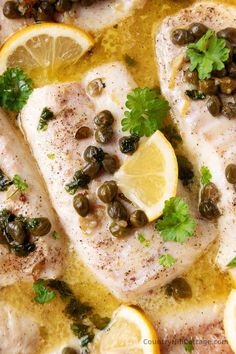 fish with lemons, olives and capers in a white sauce