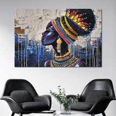 an african woman's head painted on a canvas in a living room with two chairs