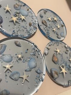 four plates with seashells and stars on them