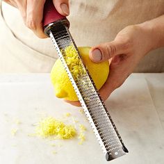 a person grating lemons with a grater