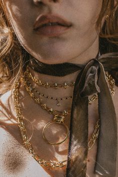 Make a statement in this badass link choker necklace with unique spiked chain detailing and a hooped adornment. ✦ Chain measures 12 inches with lobster clasp ending / 24K GP ✦ Pendant measures 1.25 inches round / 24K GP ✦ Extender measures 3 inches / 14K GF Collar Necklace Outfit, Unique Symbols, Ancient Stone, Gold Choker, Special Jewelry, Black Spinel, Cheap Jewelry, Collar Necklace, Cleaning Jewelry