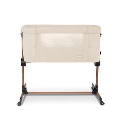 a baby crib with wheels and a mattress on it's back legs, against a white background