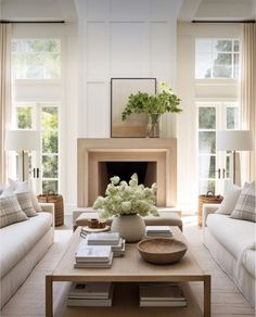 a living room filled with furniture and a fire place