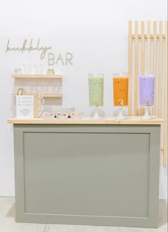 a counter with various drinks on it in a room