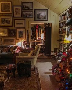 a living room filled with furniture and christmas decorations