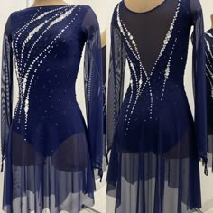 a woman's blue ballroom dress with beading on it