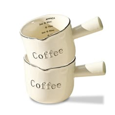 two coffee mugs with the words coffee on them