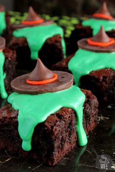 chocolate brownies with green icing and a witch hat on top