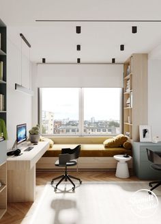 a room with a desk, chair and computer in it