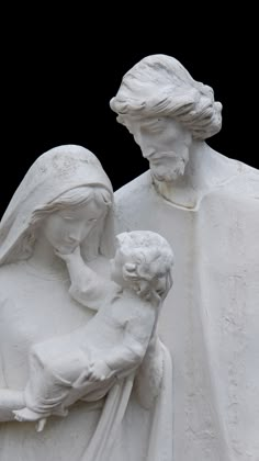 a statue of a woman holding a child