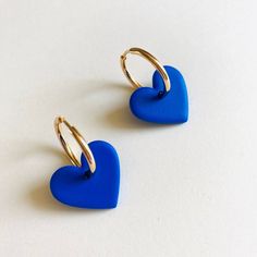 The earrings are made of polymer clay, they are ultra light to the ear. the heart measures 2cm in diameter. All buckles are designed and made by hand in France, they are unique and may vary slightly in color and shape. Polymer clay is a slightly flexible material. The buckle is covered with a light layer of resin so that it is more robust and shiny. The earrings should be stored in a clean, dry place, keep them away from oils, creams and perfumes (do not wear in water). Makeup or other dirt can Trendy Blue Heart Earrings For Gift, Blue Heart-shaped Earrings With Ear Wire, Nickel-free Blue Heart Earrings, Blue Nickel-free Heart Earrings, Blue Heart Bead Earrings, Blue Hypoallergenic Heart-shaped Earrings, Blue Heart Earrings For Pierced Ears As Gift, Blue Heart-shaped Earrings With Heart Beads, Blue Heart-shaped Earrings With Heart Charm