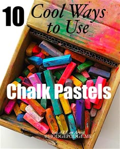 there is a wooden box filled with chalk pastels