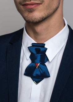 "Blue vertical bowtie, Unisex tie, prettied bowtie, Patented innovative accessories created by Ruty Design Combining traditional tie and bow tie elements, the exclusive accessory Hopper tie has become an original style detail, not only when dressing up for celebrations, but also for highlighting everyday style. This unisex accessory is a modern combination of elements found on traditional ties and bow ties. It is recommended not to tighten the regulation strip too much: Hopper is at its best whe Luxury Formal Suit And Tie Accessories With Bow Tie, Luxury Dapper Ties For Parties, Luxury Blue Suit And Tie Accessories For Formal Occasions, Luxury Blue Suit And Tie Accessories For Parties, Luxury Navy Suit And Tie Accessories For Formal Occasions, Luxury Dapper Suit And Tie Accessories For Wedding, Luxury Multicolor Formal Suit And Tie Accessories, Luxury Dapper Suit And Tie Accessories For Office, Luxury Navy Suit And Tie Accessories For Business Casual