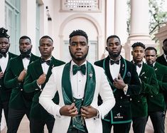 a group of men in green and white tuxedos