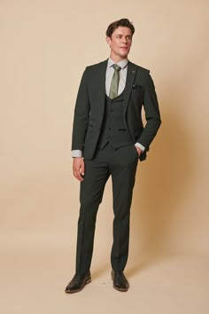 As worn by Leicester City midfielder Harry Winks! This stately three-piece suit for discerning gentlemen is a distinguished selection for formal occasions, like nuptials. Its timeless Prince of Wales check motif exudes elegance, while the elastane blend ensures ease of movement and comfort. The olive green hue accentuates any refined look. Model wears size 38R blazer, 38R waistcoat & 30R trousers. Features Slim fit Single-breasted waistcoat Prince of Wales check Notch lapel Single back vent Four Three Piece Suit Mens, Green Suit Men, Olive Green Suit, Green Wedding Suit, Mens Office Wear, Groom And Groomsmen Suits, Prince Of Wales Check, Suit For Men, Best Dressed Man